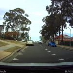 Car slowing down to give way to another car